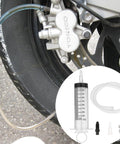 All In One Brake Bleed Kit For Hydraulic Disc Clutches And Car Brakes With 100ml Syringe, hoses, check valve, and tools next to brake system