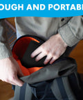 Person placing Anti Slip Sustain Pedal Mat For Digital Pianos, 4 Inch By 12 Inch Foot Pad into backpack, showcasing portability.