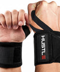 Weightlifting Wrist Wraps For Heavier Lifts 18 Inch And 12 Inch Premium Wrist Support Straps on wrists, black color, Velcro closure visible