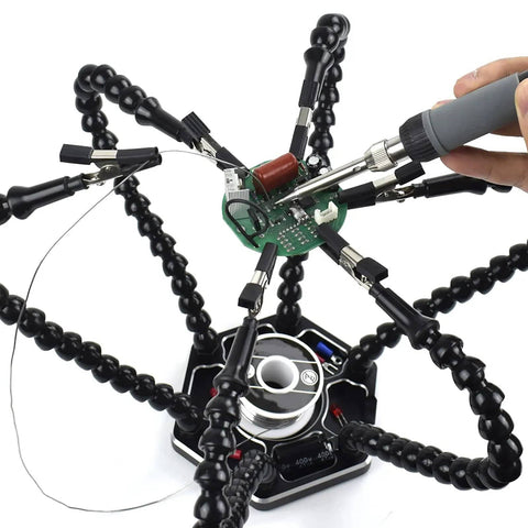 Pro Grade Helping Hands Third Hand Soldering Station with four flexible magnetic arms holding PCB and soldering tool in use