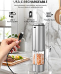 Electric Pepper Grinder Stainless Steel Rechargeable With External Coarseness Dial 95ml Capacity White LED Light Silver Finish For Freshly Ground Pepper On The Fly in kitchen setting, showing USB-C charging.