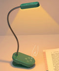 Green clip-on reading light with 16 LED double row beads illuminating a book, USB-C rechargeable for 80 plus hours.