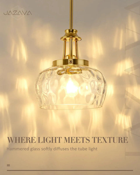 JAZAVA 10-Inch Brushed Gold Pendant Light, Modern Farmhouse Hanging Fixture with Ribbed Glass Shade illuminated.