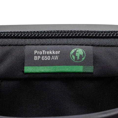 Pro Trekker BP 650 AW II Outdoor Camera Backpack With Weatherproof Cover and logo patch close-up, black and dark grey