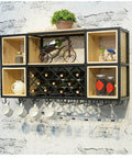 Industrial Iron And Raw Wood Wall Mounted Wine Rack, Heavy Duty Hanging Bottle Holder with stemware and decor.