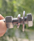 Side close-up of stainless steel 3/8-16x1-1/4 hex head bolt with nuts and flat and lock washers