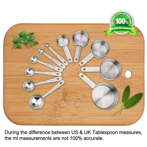 11 Piece Stainless Steel Measuring Spoons And Cups Set With Engraved Metric And Imperial Markings And Stackable Design For Everyday Cooking Baking Dry And Liquid Ingredients Great Gift, overhead on wooden board