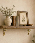 Wooden shelf on wall with antique decor supported by gold cast iron shelf brackets, set of four, heavy duty, half round decorative mounting brackets.