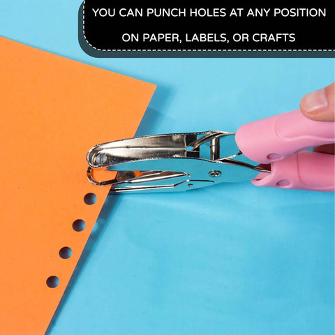 Two Pack One Quarter Inch Hole Punch For Paper Crafts handheld circle punch in use on orange paper