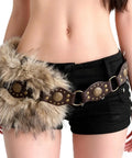 Brown Faux Fur Belt For Women Featuring Classic Pin Buckle And Y2K Vintage Street Drip With Fresh Layering Game, Plush High Pile Waist Cincher For Cozy Sweaters Plus Wide Leg Jeans, worn with shorts.