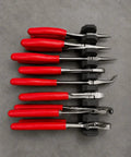 Top view of red-handled tools in Magnetic Pliers Organizer, garage workbench storage, Modular Magnetic Pliers Organizer secured to wall.