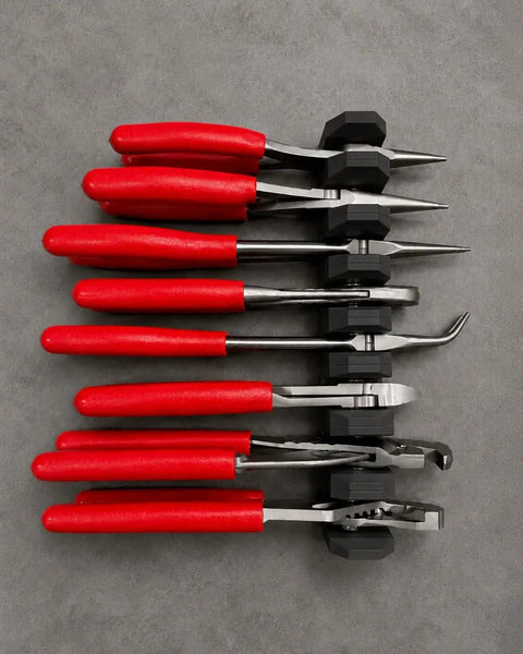 Top view of red-handled tools in Magnetic Pliers Organizer, garage workbench storage, Modular Magnetic Pliers Organizer secured to wall.