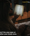 Person using rechargeable reading light clip on for glasses while reading book in bed, with child sleeping, award winning design visible.