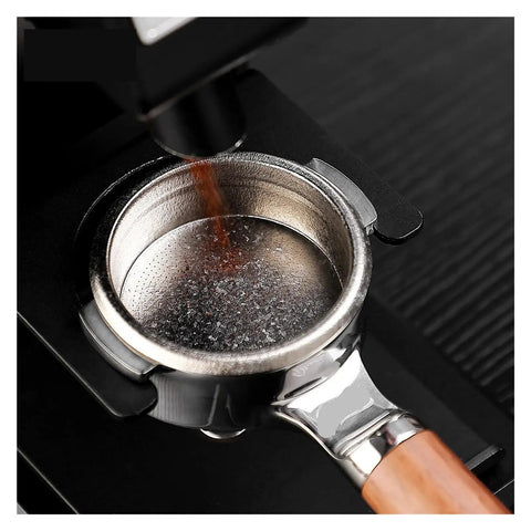Dope Titanium Espresso Distributor And Ground Leveling Tool For Even Coffee Bed Prep In 58.5mm Portafilter Baskets with coffee grounds being dispensed.
