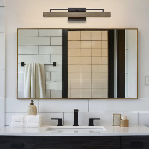 Modern Farmhouse Integrated LED Vanity Light Bar, 24W 3000K Warm White Glow, 25-Inch Hand-Painted Wood Grain Metal Linear Sconce With Smoked Birch And Black Finish over a bathroom mirror.