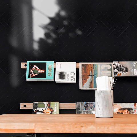 Black Herringbone Peel And Stick Kitchen Backsplash Tiles Kit Covering 14.64 Sq Ft Aluminum Composite Panels behind magazine rack