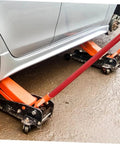 Heavy Duty Floor Jack Handle Replacement With Textured Grip Sleeve For 50 Ton Hydraulic Bottle Lifts, glossy red, in use with jack.