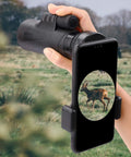 Universal Telescope Phone Adapter Clip Mount for Smartphones Fits Binoculars Monocular Microscope Spotting Scope and Telescope Eyepieces in use with a deer in view, showcasing hands-free setup.