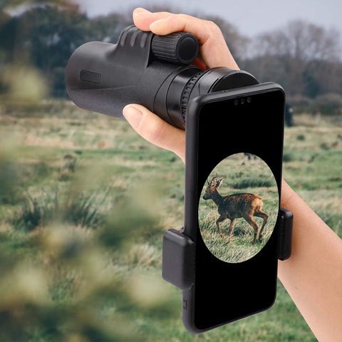 Universal Telescope Phone Adapter Clip Mount for Smartphones Fits Binoculars Monocular Microscope Spotting Scope and Telescope Eyepieces in use with a deer in view, showcasing hands-free setup.