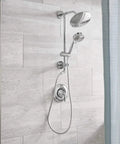 Brushed Nickel Handheld Showerhead With Four Functions Full Spray Invigorating Spray Targeted Massage And Combo WaterSense Certified Eco Performance 164927BN installed in modern bathroom