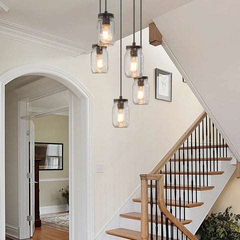 5 Light Mason Jar Chandelier Pendant For Kitchen Island And Dining Room, hanging in a rustic staircase with bronze canopy