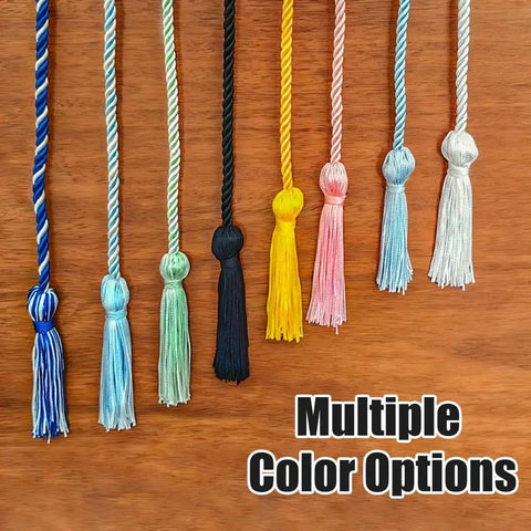 Various colored graduation cords on wood, including blue, representing Light Blue Graduation Honor Cords 67 Inch 3 Strand Thick Braided Rope For Class Of 2025 And 2026 Graduates, Premium Graduation Gown Accessory For High School And College Ceremonies