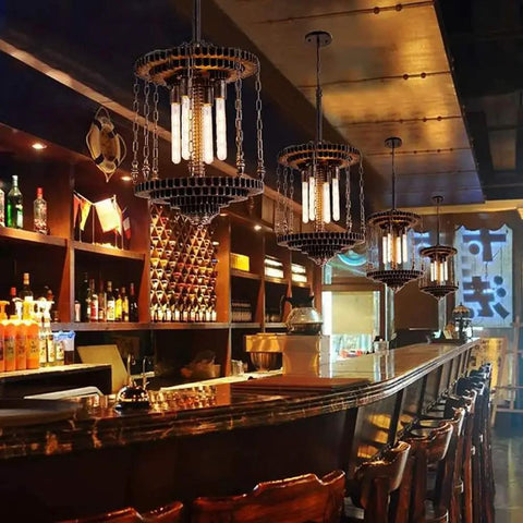 Bar interior with pendant lights using Dimmable T10 LED Filament Tubular Bulbs 4000K Daylight White, clear glass cover, Edison style.