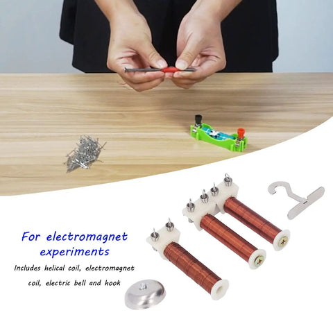 Classroom Magnetic Field Experiment Kit With Helical Coil And Electric Bell, hands testing copper coil components on table