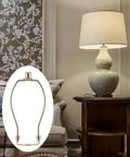Straight Fire Slick Polished Brass Lamp Harp 10 Inch Light Duty Replacement Hardware with lampshade on a decorative table.