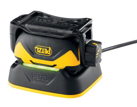 Pixa 3R Rechargeable Headlamp docked on charging base, black and yellow design, durable build, long battery life, side view