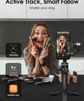 Woman using iSteady M6 Gimbal Stabilizer For Smartphone That Delivers Ultra Smooth Footage With 3 Axis Anti Shake and OLED display.