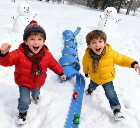 Kids playing with 15 Ft Flexible Race Car Track Starter Set in snow, blue racetrack, two toy cars, smiling, winter coats, snowmen