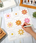 Retro Groovy Floral Name Tag Stickers With Daisy Flower Nameplates for Back To School Classroom, hand writing on a sticker sheet