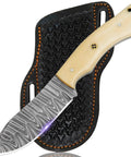 Handmade Damascus Hunting Knife With Cream Bone Handle Fixed Blade Outdoor Utility Tool For Camping And Survival Beefy Full Tang Durability Classic Craft Everyday Carry Ready beside black sheath