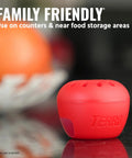 Indoor Fruit Fly Trap 4 Pack With 180 Day Food Based Lure, red apple-shaped trap on kitchen counter near fruit.