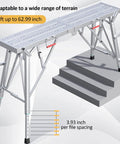 Heavy Duty Portable Scaffolding And Adjustable Work Platform With Rock Solid Stability And Zero Sweat Folding Setup For Ace Ceiling Jobs Car Cleans Or Home Repairs Up To Eight Hundred Pounds Max Load, shown in adjustable position next to stairs.