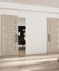 Premium 36X84 Inch 5 Panel Concealed Sliding Barn Door With Hassle Free Smooth Glide Track And Slam Free Soft Close Hardware Ready To Paint White Primed Solid Core Room Divider For Every Home Remodel, shown in a stylish modern interior.