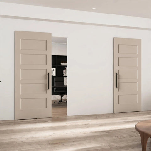 Premium 36X84 Inch 5 Panel Concealed Sliding Barn Door With Hassle Free Smooth Glide Track And Slam Free Soft Close Hardware Ready To Paint White Primed Solid Core Room Divider For Every Home Remodel, shown in a stylish modern interior.