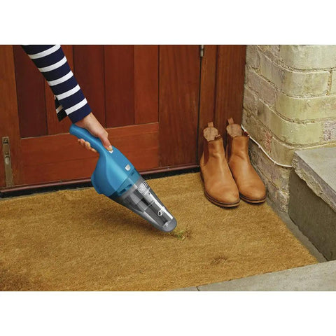 Person using Cordless Handheld Vacuum For Home And Car Cleaning, Lightweight Grab-And-Go Dustbuster on doormat