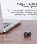 AC1300 USB WiFi Adapter Archer T3U Dual Band Wireless Dongle on desk near laptop