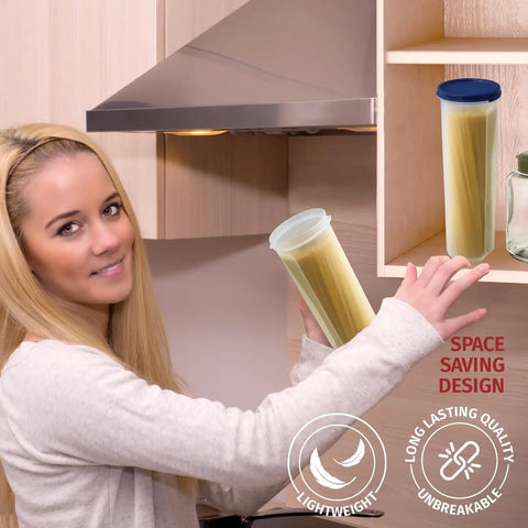 Person placing tall clear spaghetti pasta storage jar with airtight lid in kitchen cabinet, ideal for pantry organization.