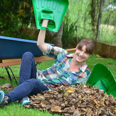 Woman using Big Leaf Scoops For Fast Leaf Cleanup Ergonomic Handheld Rakes With Oversize Claws For Lawn Debris Works Wet Or Dry
