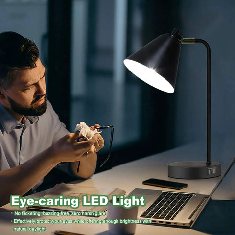 Man using 3 Way Dimmable Touch Desk Lamp With 2 USB Ports And AC Outlet for reading at night, showcasing flexible head and eye-caring light