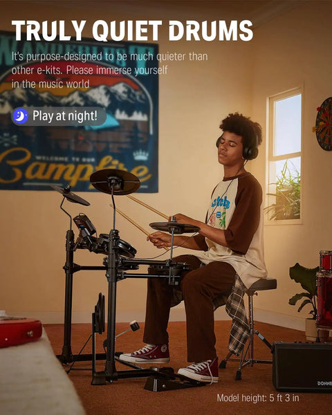 Person playing DED-80 Electronic Drum Set With 4 Quiet Mesh Pads in a cozy room, showcasing headphones and solid drum throne.