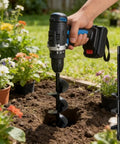 Person using Extended Length Auger Drill Bit For Planting 1.6 In By 8.66 In Spiral Hole Digger in garden with drill.