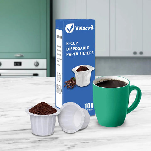 Disposable Paper Filters For Keurig K Cup Pods, 100 Count, box with filter and coffee cup on kitchen counter.