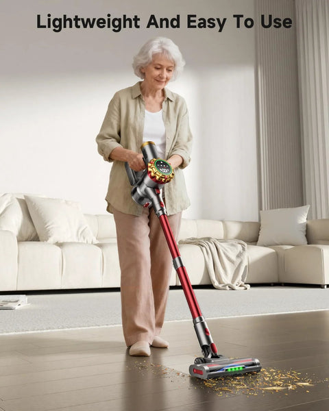 Cordless stick vacuum cleaner, red wand with silver head, front view on hardwood floor