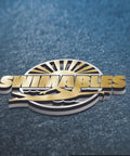 Swimables logo with swimmer silhouette and sunburst design on textured background