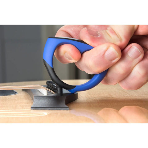 Premium Acoustic Guitar Bridge Pin Puller in use with ergonomic grip, safely lifting bridge pins without damage.