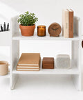 White Desktop Shelf Organizer With Adjustable Two Tier Design Space Saving For Dorm Room And Office shown with books and accessories